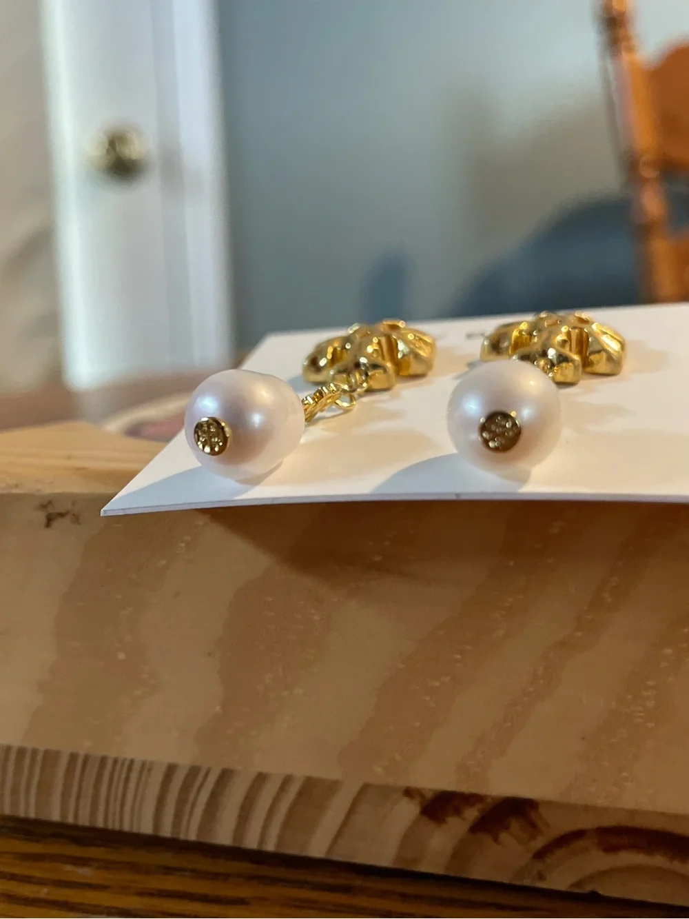 Brand new pearl-drop earrings by Tory Burch.
